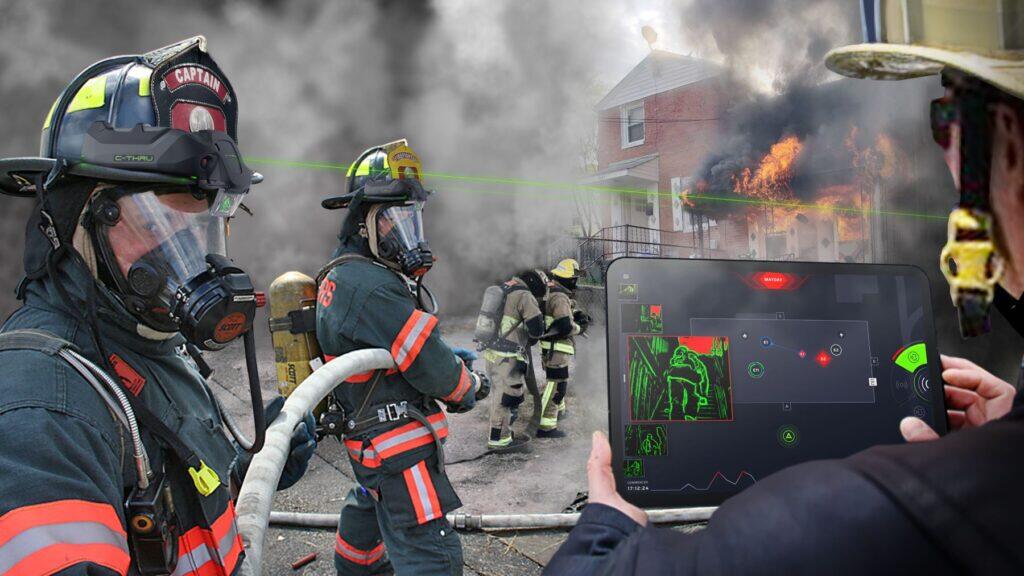 A house on fire, with flames and black smoke coming out of it. Four firefighters are holding hoses in front of the house. A fifth firefighter is holding a tablet showing green outlines of firefighters inside the house, one walking up the stairs.