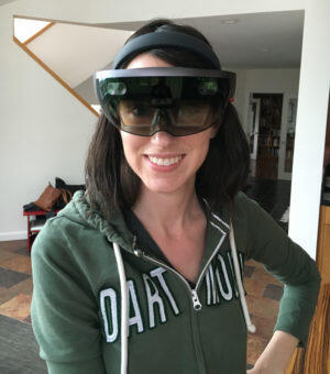 Cooper in 2016, wearing the Microsoft HoloLens, a head-mounted mixed-reality display.